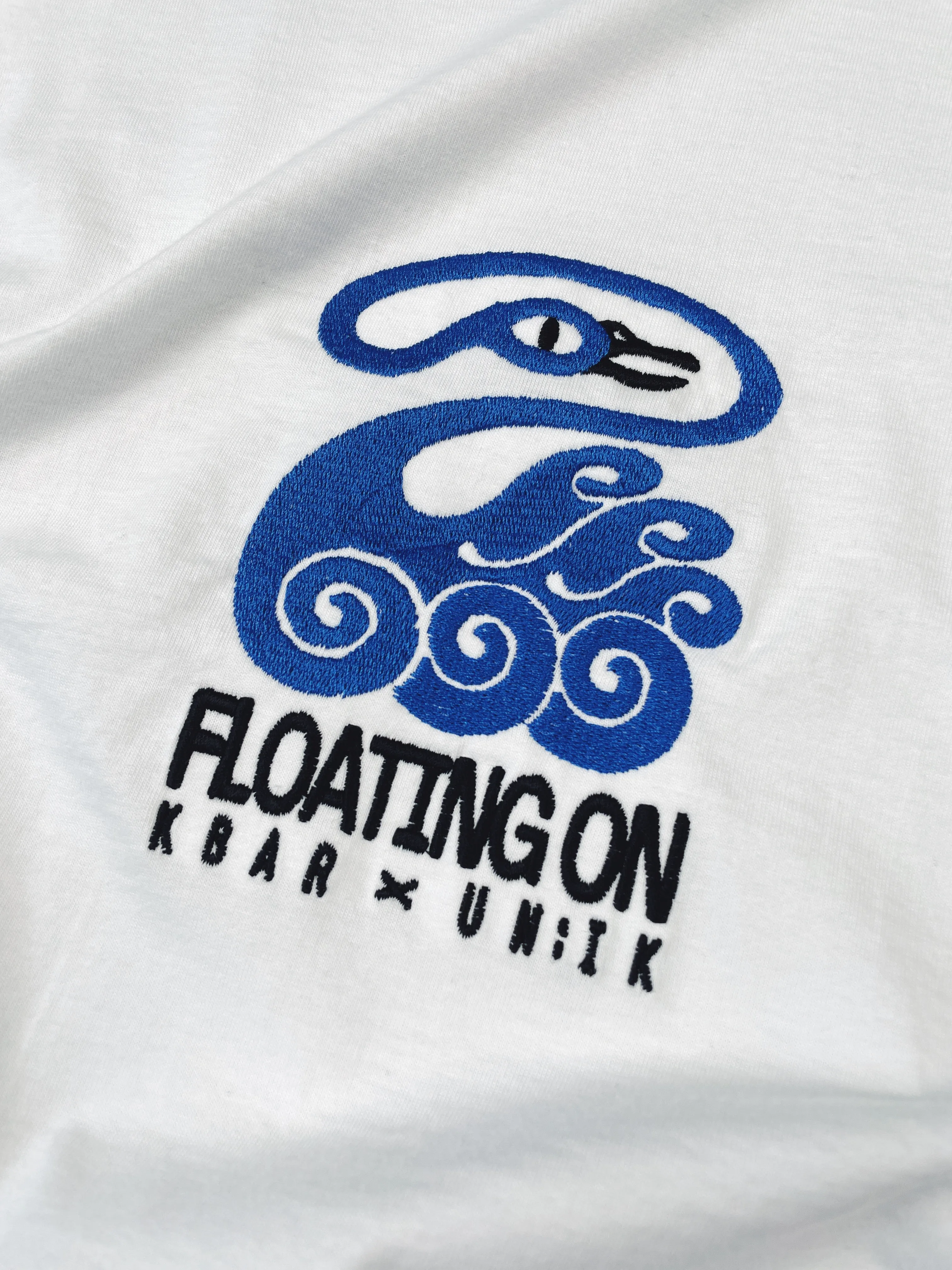 KBAR X UN:IK 'Floating On' Embroidered Tee - White