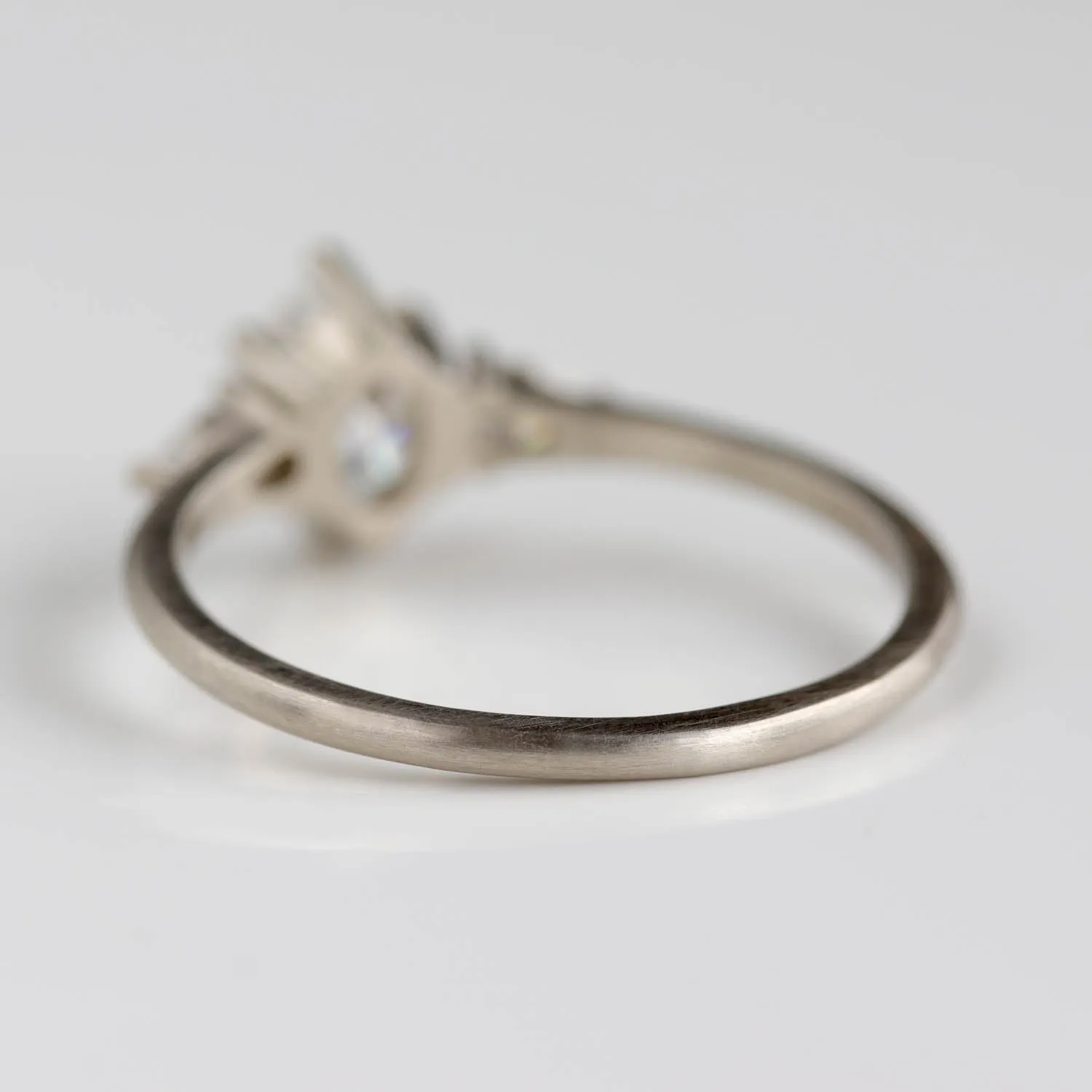 Prong-set Oval Three Stone Ring with Pear-shaped Side Stones